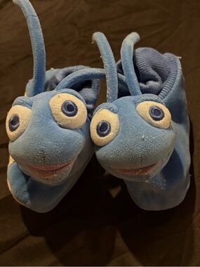 Disney plush slippers featuring the character Flik from Bugs Life is 7/8
